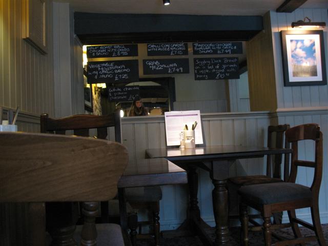 The Burley Ghost 1 - look how the woman's hair seems to obscure the price on the chalk board.